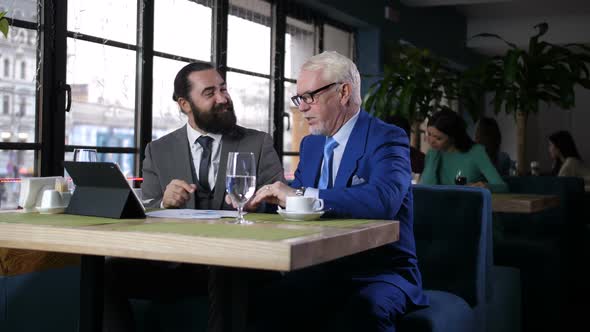 Two Businessmen Coming To Agreement During Meeting