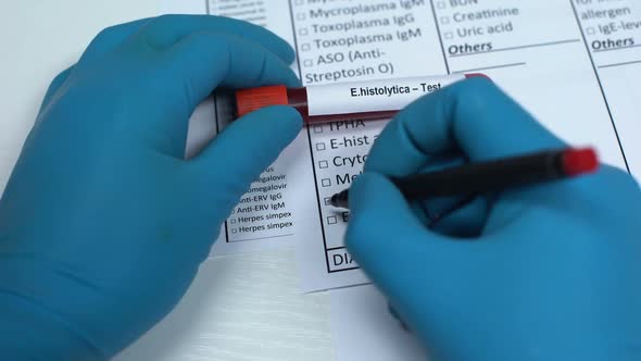 E Histolytica, Doctor Checking Name in Lab Blank, Showing Blood Sample in Tube