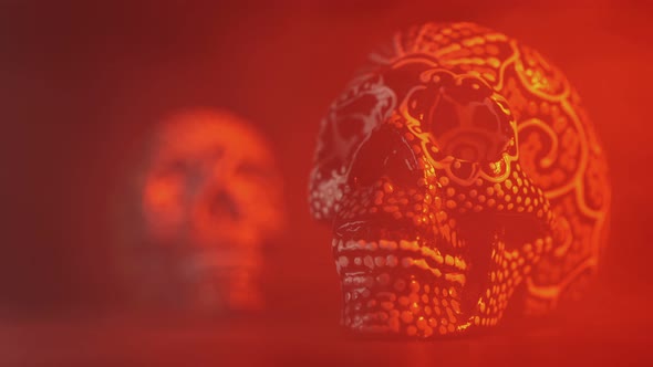 Painted Skull for the Day of the Dead in Red Light with Smoke