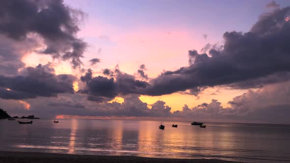 Dancing Boats At Sunrise Under Big Clouds