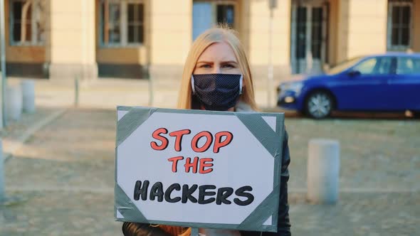 Concerned Woman with Protest Banner Calling to Stop Hackers