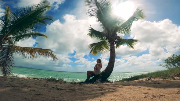 Ocean Coast with Palm Trees and a Relaxed Lady