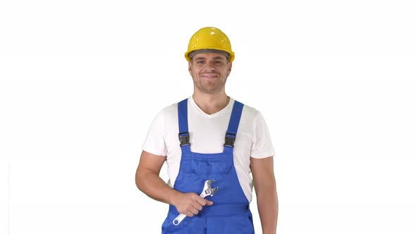 Worker with Wrench Showing Thumb Up and Smiling To Camera on White Background.