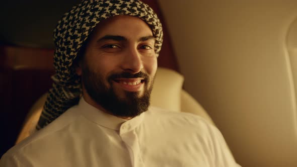 Smiling Arabic Man Posing at Airplane Window Closeup