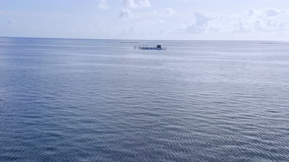 Drone Flying Over The Sea Towards An Offshore Dolphinarium. Dolphin Island Park Off The Coast Of Pun