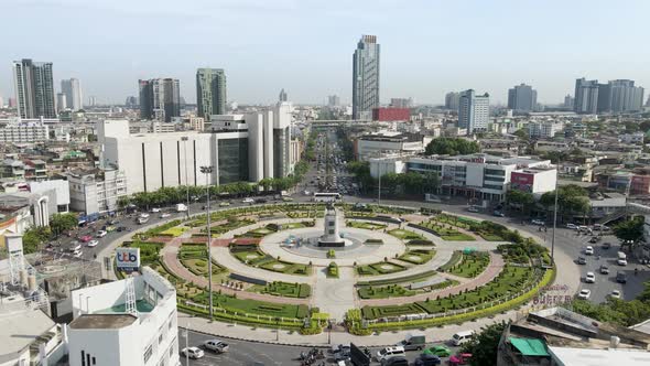 Fly Over Wongwian Yai roundabout in Bangkok Thailand, busy traffic roads cars merging lanes