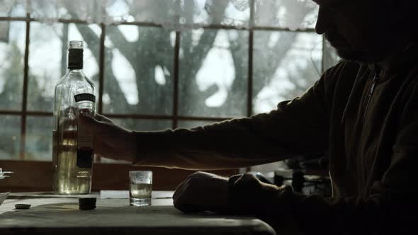 Close Up of A Man Drinks Alcohol Alone He Thinks for a Long Time Before Drinking Alcochol