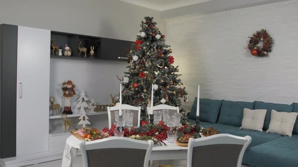 Christmas Table Full with Delicious Dishes in a Beautifully Arranged Living Room