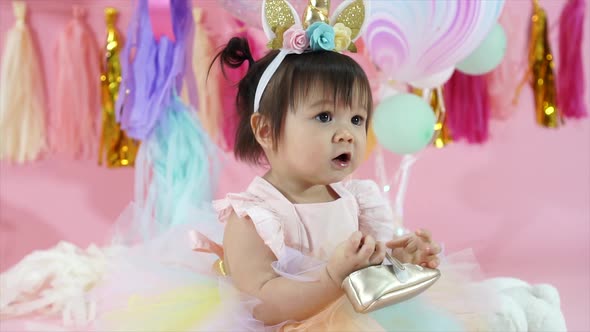 Cute Toddler Baby Girl at Birthday Party Smiling and Clapping Hands