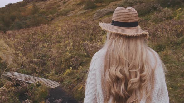 Woman Walking In Icelandic Countryside