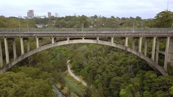 Side view of Long Gully Suspension Bridge with traffic in Northbridge area of Sydney, Australia, Aer