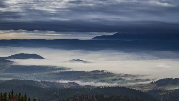 Stunning sunrise in the Tatra mountains with flowing clouds, Poland, Timelapse