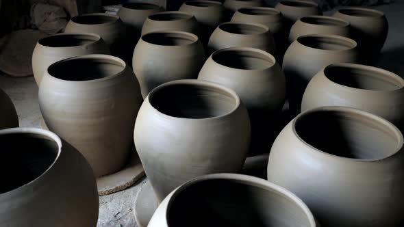 Freshly molded handmade clay vessels at the potters workshop.