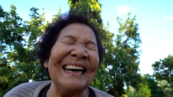 slow-motion of senior woman laughing
