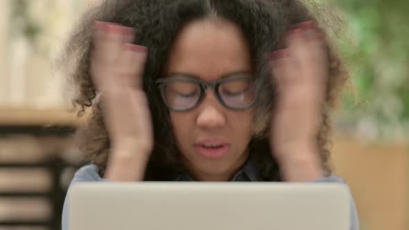 Close Up of African Woman Having Loss on Laptop