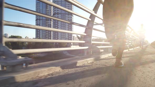 Active Urban Joggers Training Outdoors in Sunlight