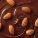 melted premium dark chocolate and nuts almond top view rotating - VideoHive Item for Sale