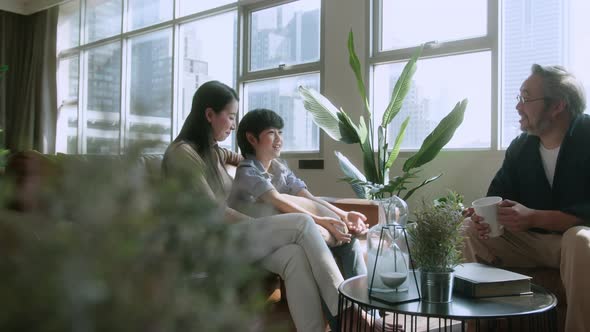 Asian family sit relax positive conversation with son