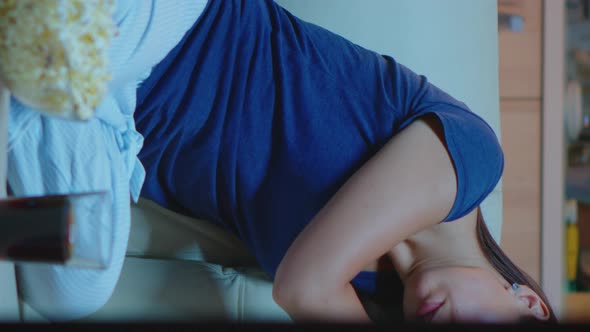 Vertical Video: Portrait of Young Woman Asleep on Couch