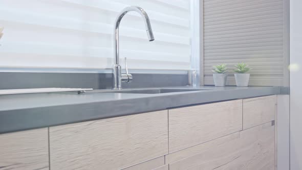 Tracking shot of a luxury kitchen with wood finish modern design