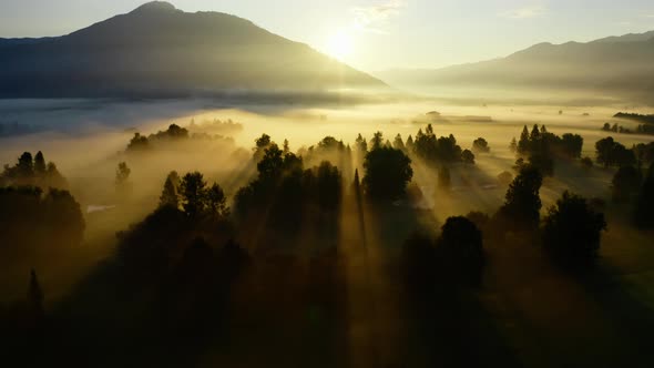 Drone Over Ethereal Misty Landscape Of Zell Am See At Sunrise