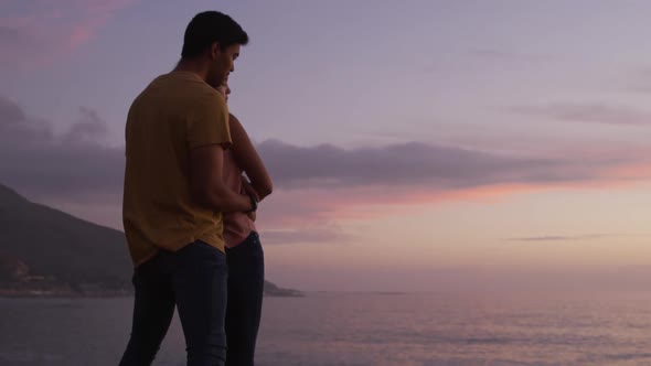 Young couple enjoying the sunset view