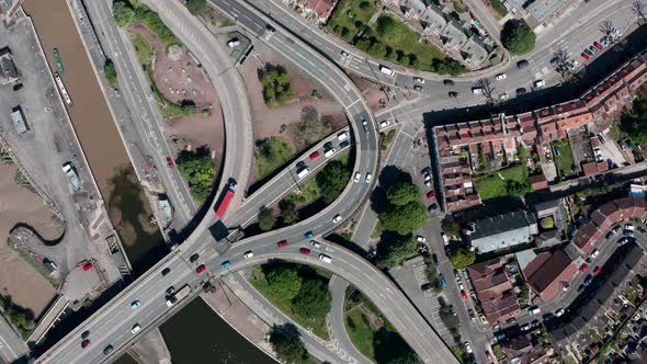 Rising drone shot of complicated road junction over bristol canal