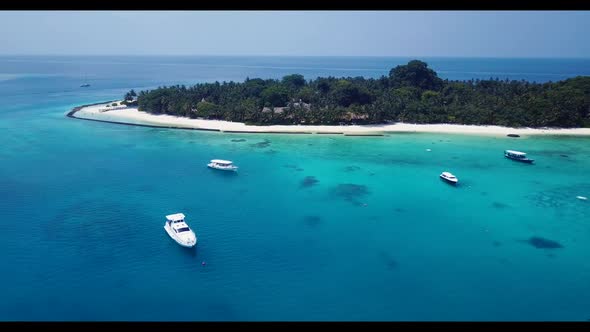 Aerial drone view sky of idyllic seashore beach lifestyle by aqua blue ocean with white sandy backgr