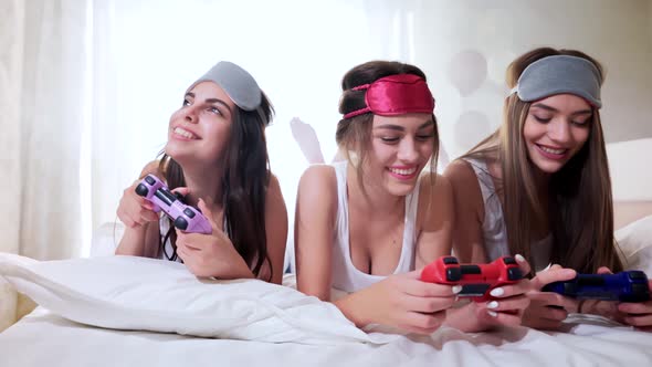 Smiling Women Playing with Video Game with Joystick.