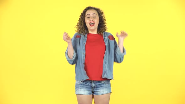 Girl Listens Carefully Then Rejoices in Victory, Celebrating Her Triumph with Victory Dances