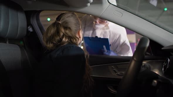 Handheld video of stopping a car to make a coronavirus test. Shot with RED helium camera in 8K.