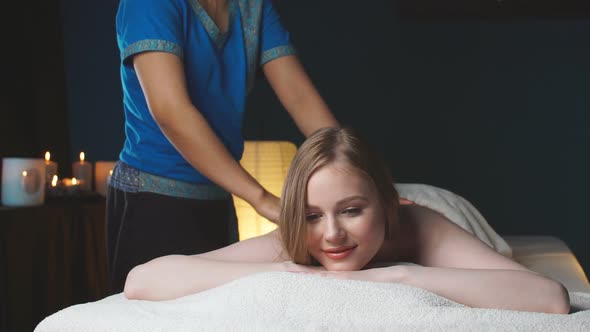 Woman Enjoing Back Massage at Spa. Leisure, Health, Luxury Lifestyle Concept