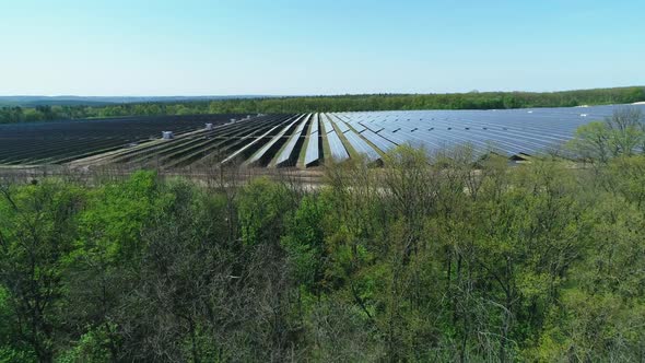 Aerial View of Solar Power Station Field at Sunny Day. Aerial Top View of Solar Farm. Renewable