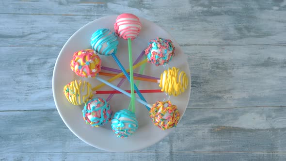 Colorful Cake Pops on Wooden Background