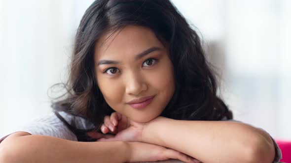 Closeup Portrait of Pretty Asian Young Woman with Perfect Clear Skin and Natural Makeup