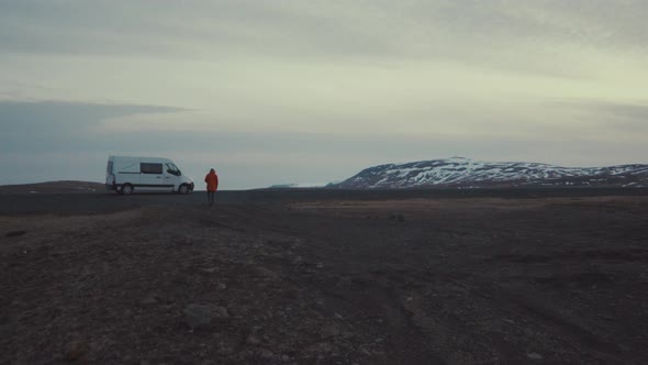 Traveler with van in dark valley