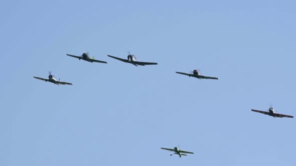 Group of Piston Rotary Airplanes Performs Aerobatic in The Sky