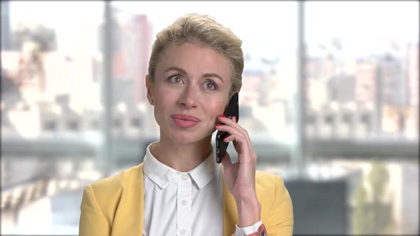 Young Pretty Business Lady Talking on Smartphone.