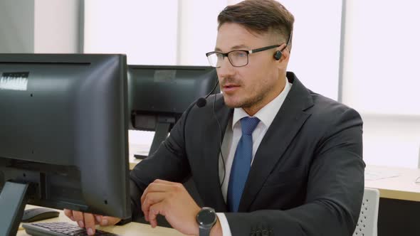 Business People Wearing Headset Working in Office