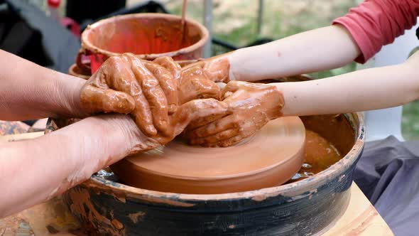 Woman and Girl Making Ceramic Pot in Pottery Workshop