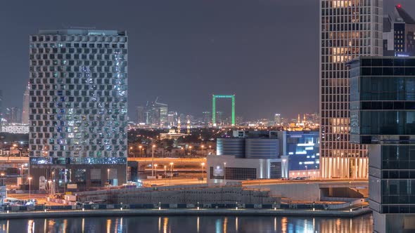 Bright Night in Dubai Near Canal Aerial Timelapse