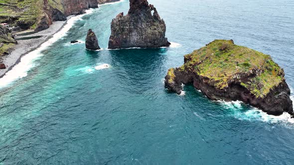Natural wonder of rugged rocky islets, Porto Moniz, Madeira north coast; drone