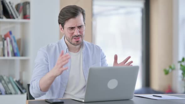 Man in Glasses with Laptop Having Loss Failure