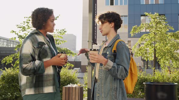 Couple Drinking Coffee in City in Summer