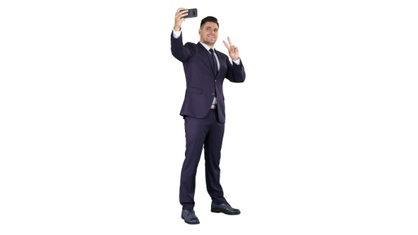 Business man taking selfie on white background.