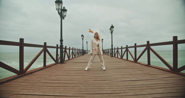 Beautiful Woman Posing In Suit On Pier