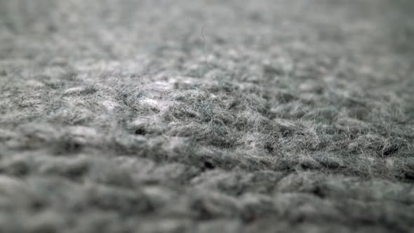 Extreme Detail View of Sheep Wool Cloth Texture Flowing in Macro Dolly Shot