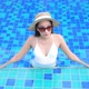 Young asian woman enjoy around outdoor swimming pool for leisure - VideoHive Item for Sale