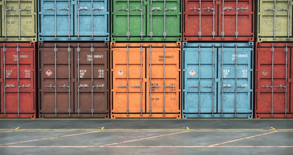 Moving Along Line of Cargo Containers Painted in Colors of Different Freight Transport Companies