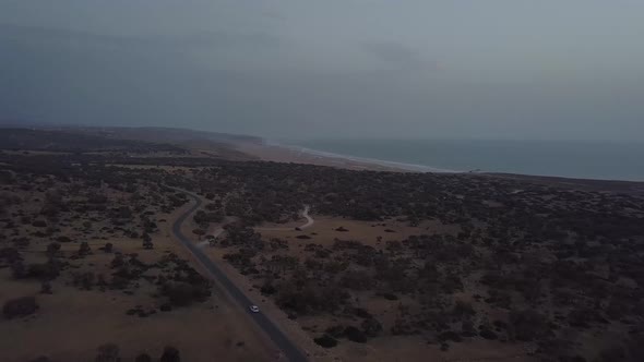 Aerial view of car driving in the south of morocco